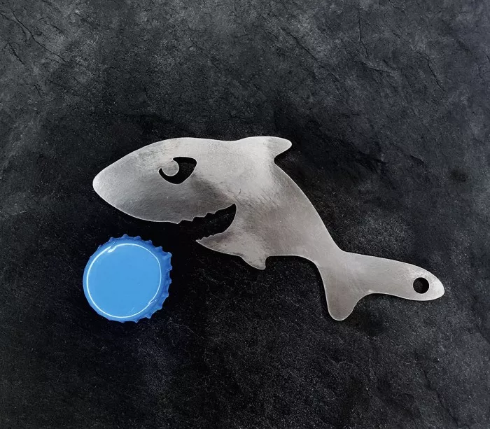 Bottle opener for opening a soda or beer at the beach