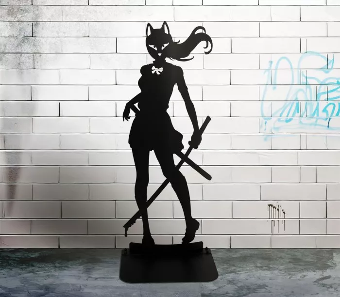 Black silhouette sculpture of a female manga character armed with a katana